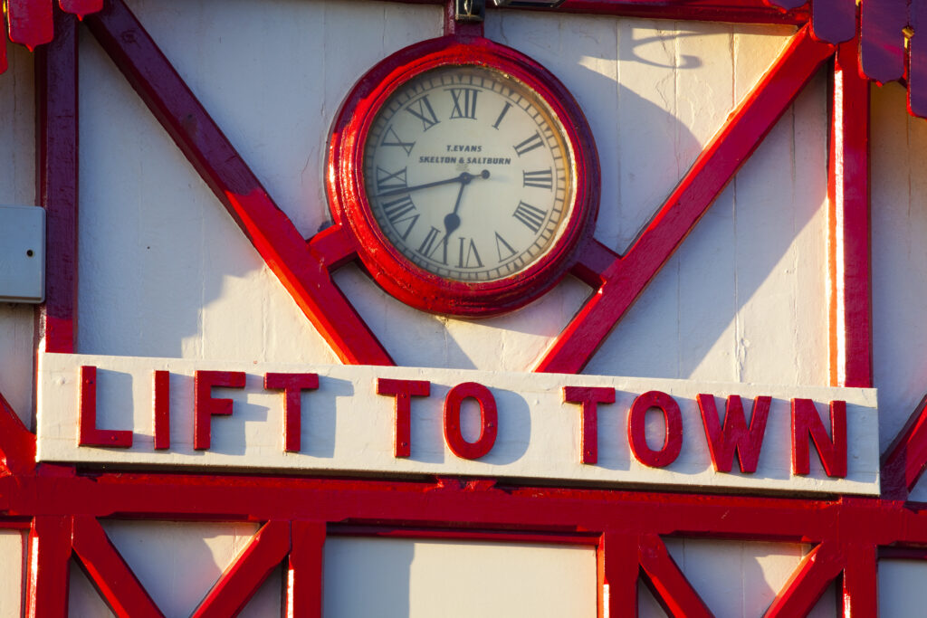 England, Cleveland, Saltburn-by-the-Sea. "Lift to town" sign on the station of the funicular railway, one of the world's oldest water-powered cliff lifts.