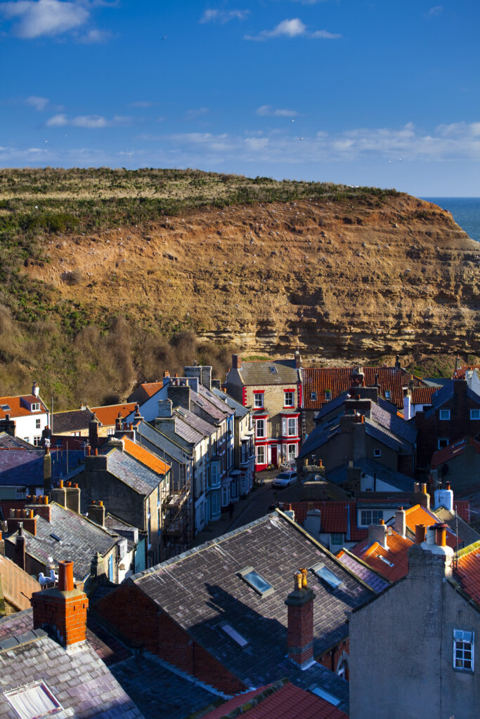 England, North Yorkshire, Staithes. View looking down on the roofs and chimney pots of the old town of Staithes, located within the North York Moors National Park.