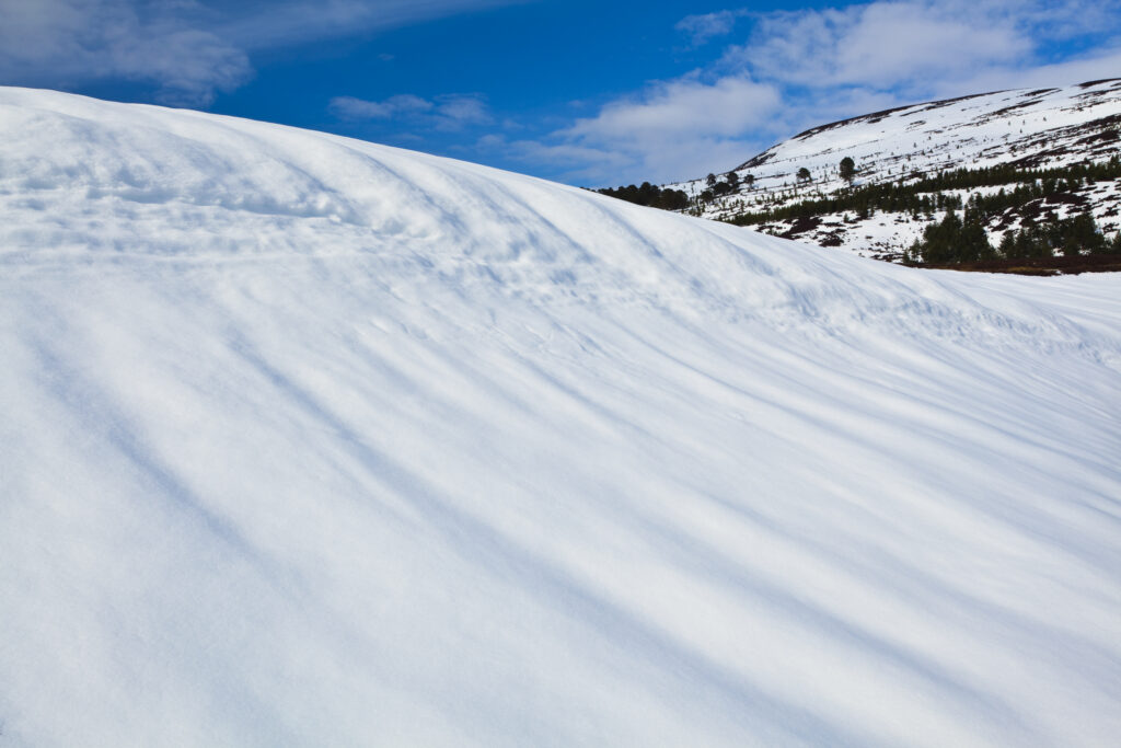 Scotland, Scottish Highlands, Cairngorms National Park. Snow covered hills in the remote Glen Feshie, part of the Cairngorms National Park.