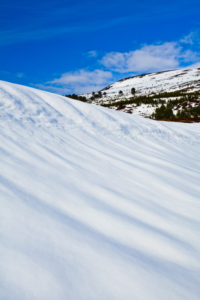 Scotland, Scottish Highlands, Cairngorms National Park. Snow covered hills in the remote Glen Feshie, part of the Cairngorms National Park.