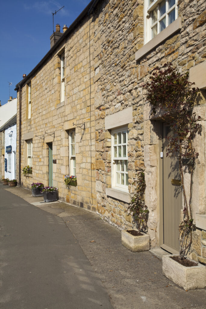 England, Northumberland, Corbridge. Typical Corbridge street and residential houses and shops.
