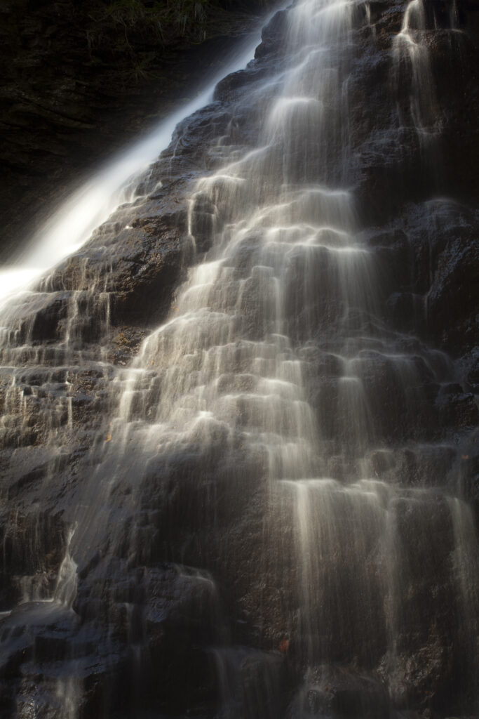 England, Northumberland, Hareshaw Linn. Hareshaw Linn is a spectacular waterfall located in a steep sided gorge, which continues to flow through a wooded valley. Hareshaw Linn is located near Bellingham within the Northumberland National Park.