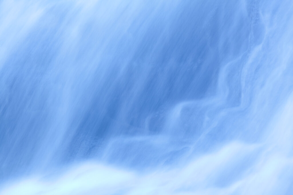 England, Northumberland, Hareshaw Linn. Detail shot of a cascade of water, part of the Hareshaw Linn waterfall.