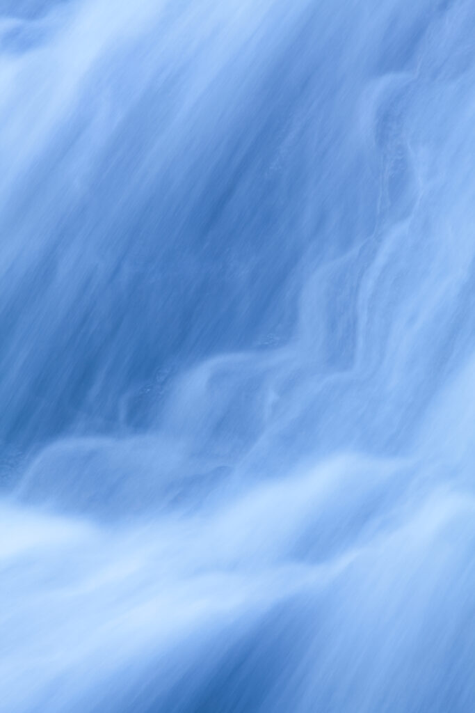 England, Northumberland, Hareshaw Linn. Detail shot of a cascade of water, part of the Hareshaw Linn waterfall.
