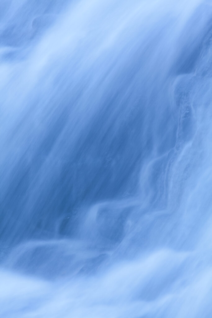 England, Northumberland, Hareshaw Linn. Detail shot of a cascade of water, part of the Hareshaw Linn waterfall.