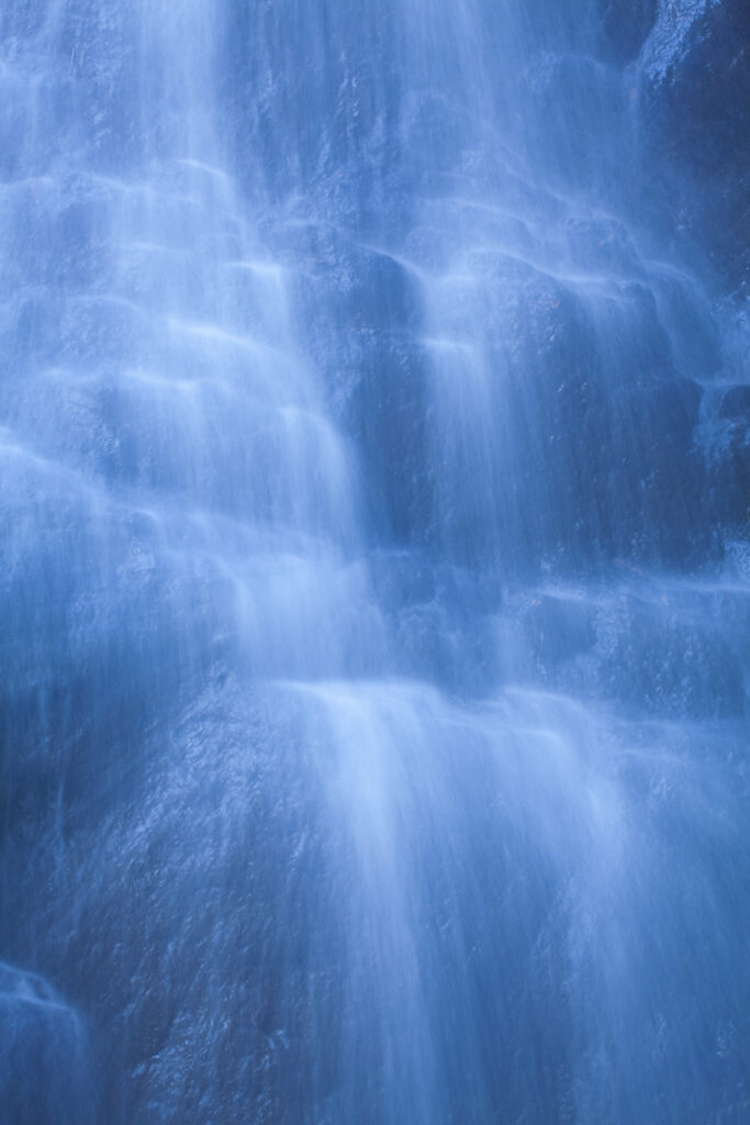 England, Northumberland, Hareshaw Linn. Detail shot of a cascade of water, part of the Hareshaw Linn waterfall.