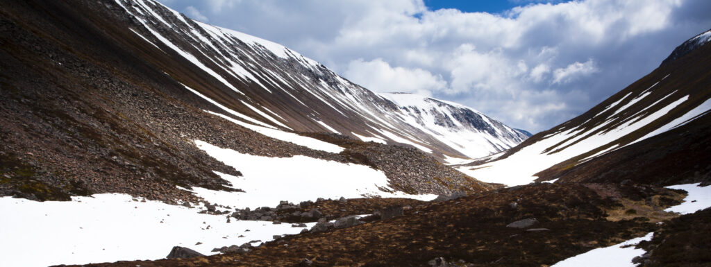 Scotland, Scottish Highlands, Cairngorms National Park. The remnants of an harsh winter in the wild valley of the Lairig Ghru.