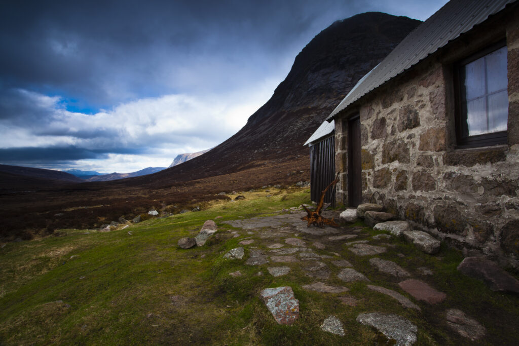 Scotland, Scottish Highlands, Cairngorms National Park. A storm approaches the Corrour Bothy, located along the infamous Lairig Ghru.