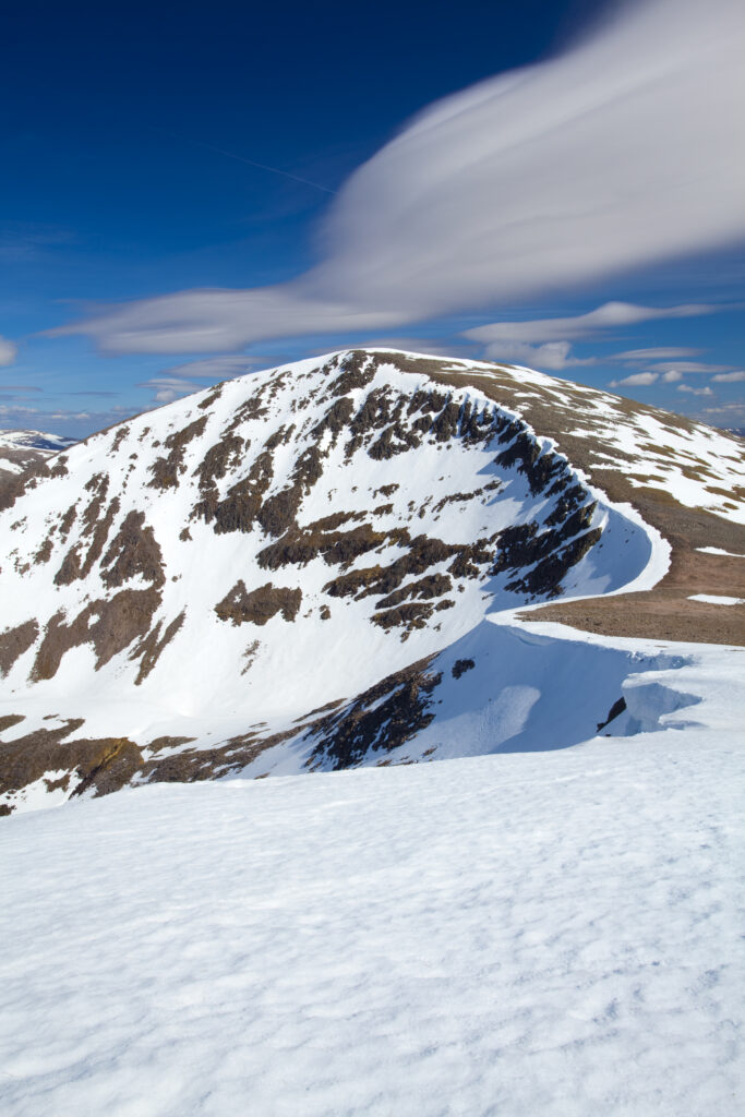 Scotland, Scottish Highlands, Cairngorms National Park. Looking towards the snow covered Cairn Toul, with the southern peaks of the National Park in the distance.