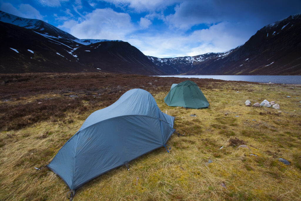 Scotland, Scottish Highlands, Cairngorms National Park. Hikers wild camping near Loch Eanaich in Gleann Eanaich.