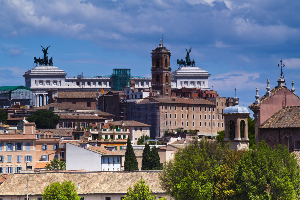 Italy, Lazio, Rome. View looking across the city of Rome, from Aventine hill towards the National Monument of Victor Emmanuel II.