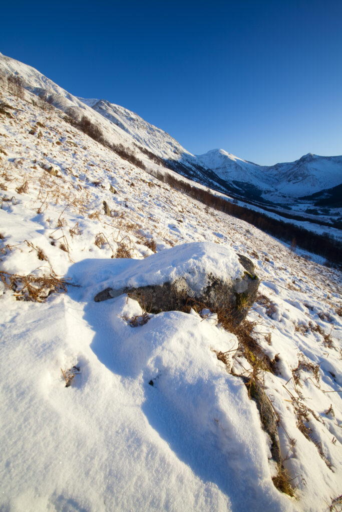 Scotland, Scottish Highlands, Glen Nevis. The snow covered Glen Nevis, looking towards Carn Dearg on the lower slopes of the highest mountain to be found in Scotland and the UK - Ben Nevis.