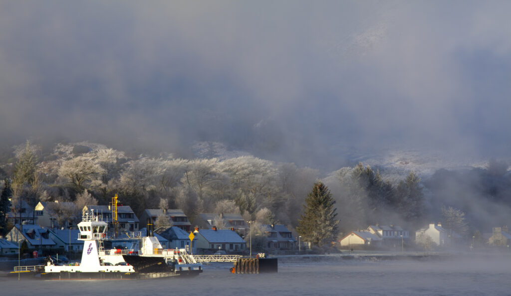 Scotland, Scottish Highlands, Corran. The Corran ferry port with hoarfrost covered woodland behind.
