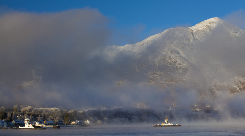Scotland, Scottish Highlands, Corran. The Corran ferry port with hoarfrost covered woodland behind.
