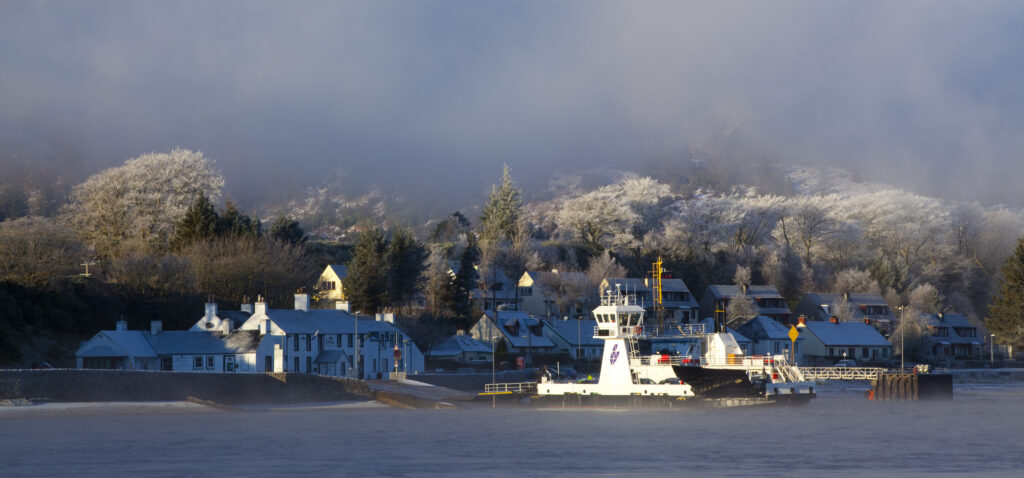 Scotland, Scottish Highlands, Corran. The Corran ferry port with hoarfrost covered woodland behind.