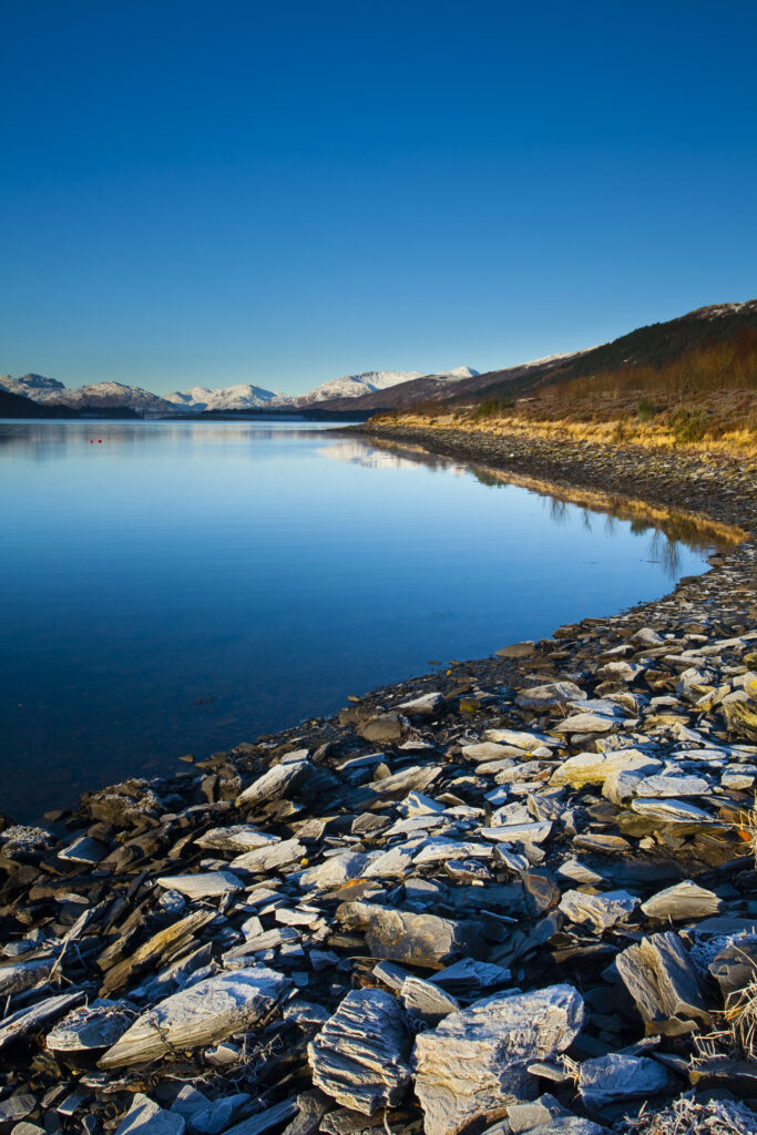 Scotland, Scottish Highlands, Ballachulish. The frost covered shoreline of Loch Leven, near Glencoe.