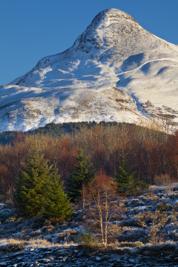 Scotland, Scottish Highlands, Glencoe. The Pap of Glencoe (Sgorr na Ciche) covered in a fresh sprinking of snow.