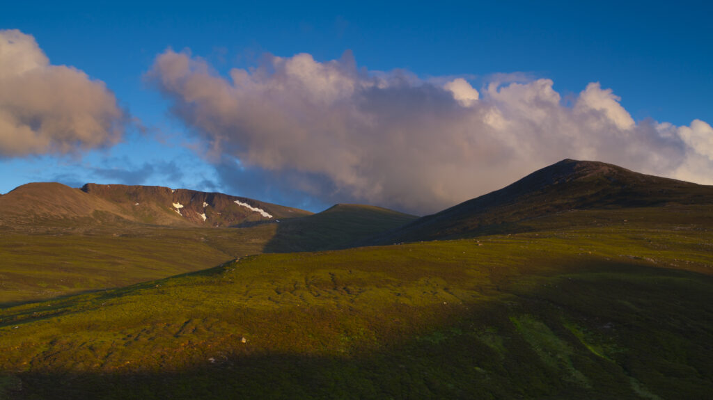 Scotland, Scottish Highlands, Cairngorms National Park. Late evening sun illuminates the peaks of the Cairngorm Massif.