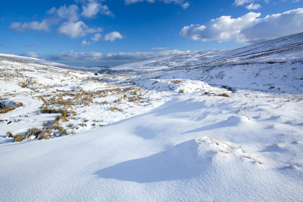 England, Northumberland, Northumberland National Park. Snow on the Cheviot Hills near Comb Fell and the Breamish Valley.