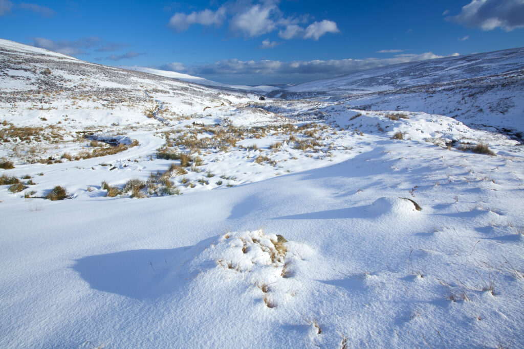 England, Northumberland, Northumberland National Park. Snow on the Cheviot Hills near Comb Fell and the Breamish Valley.