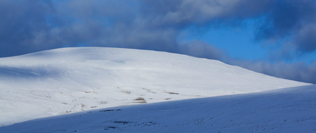England, Northumberland, Northumberland National Park. Snow on the Cheviot Hills near Comb Fell and the Breamish Valley.
