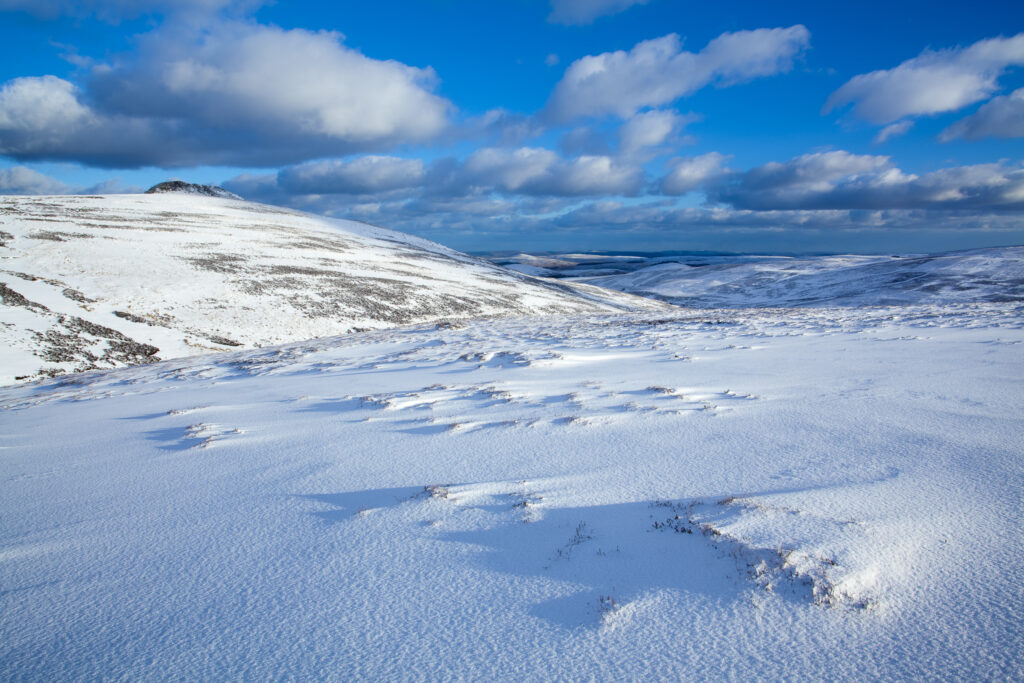 England, Northumberland, Northumberland National Park. Snow on the Cheviot Hills near Comb Fell and the Breamish Valley.