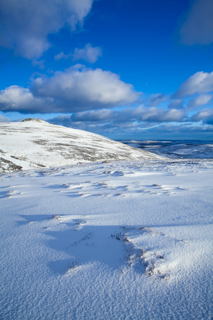 England, Northumberland, Northumberland National Park. Snow on the Cheviot Hills near Comb Fell and the Breamish Valley.