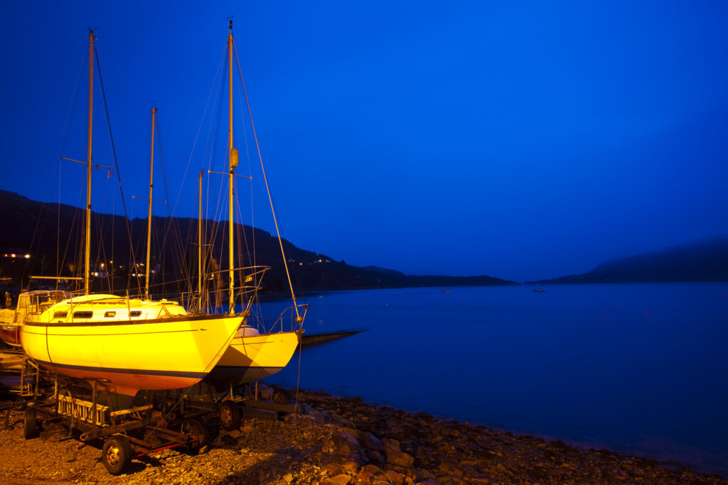 Scotland, Scottish Highlands, Ullapool. Sailing boats moored near the busy port at Ullapool on the shores of Loch Broom.
