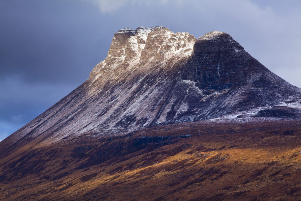 Scotland, Scottish Highlands, Assynt. Stac Pollaidh (also know as "Stack Polly") is an impressive mountain found in the Assynt area, located north of Ullapool. Despite its dramatic appearance, it is only 613 metres (2009 feet) in height.