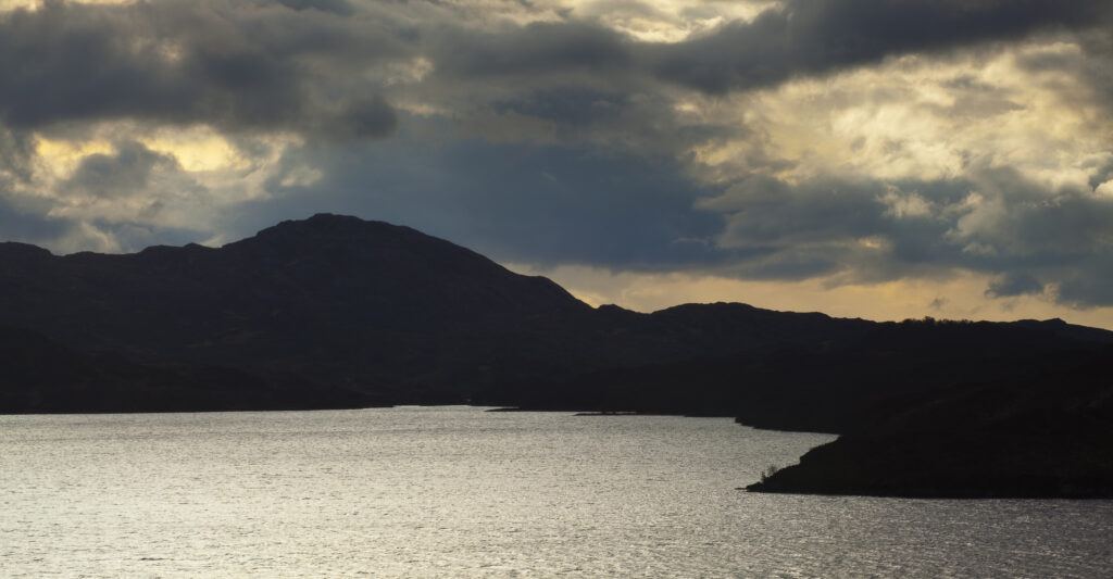 Scotland, Scottish Highlands, Assynt. Clearing storm clouds above Loch Assynt near Lochinver.