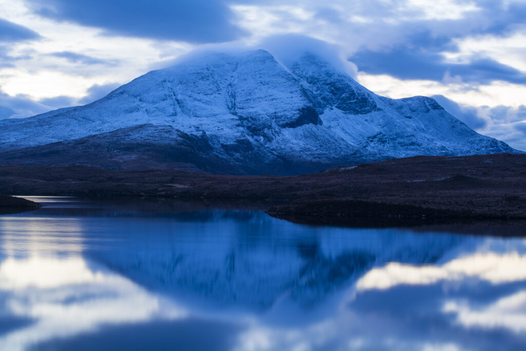 Scotland, Scottish Highlands, Assynt. Clouds clear from the peak of Cùl Beag, a mountain in the Assynt parish of Sutherland.