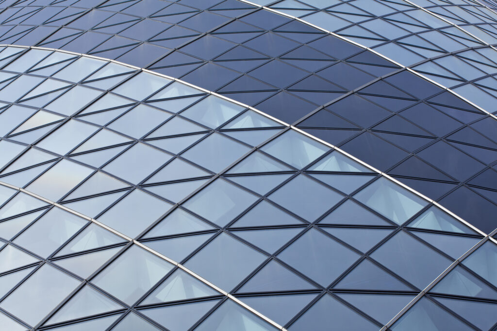 England, Greater London, The City of London. Abstract view of the modern architecture of the famous Gherkin building, in the financial square mile in the City of London.