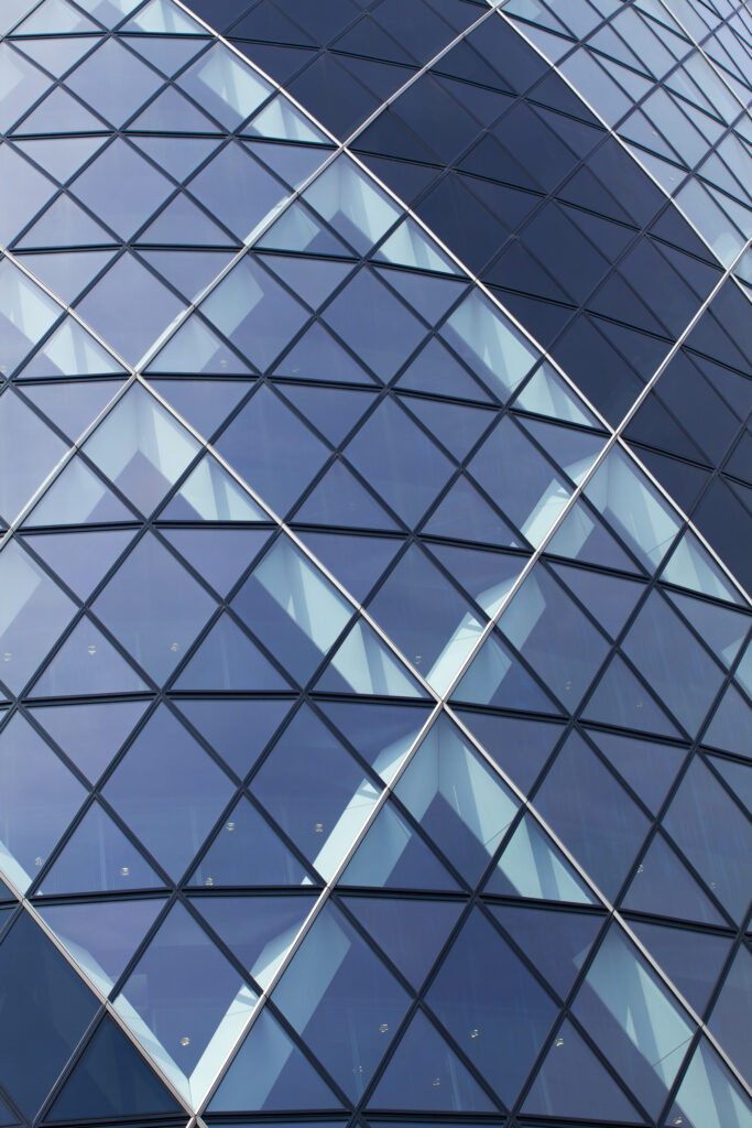 England, Greater London, The City of London. Abstract view of the modern architecture of the famous Gherkin building, in the financial square mile in the City of London.