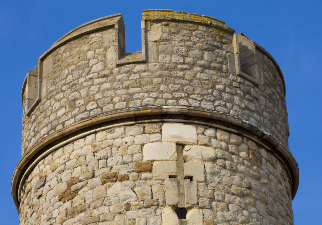 England, Greater London, London Borough of Tower Hamlets. Close up view of one of the towers of the Tower of London, located on the north bank of the River Thames.