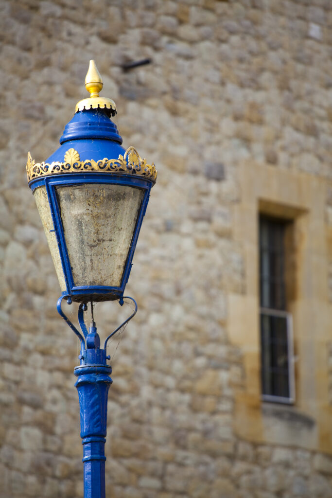 England, Greater London, London Borough of Tower Hamlets. Close up view of ornate street lamp outside the Tower of London, located on the north bank of the River Thames.