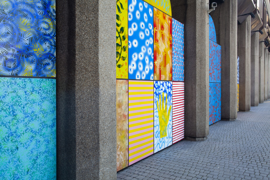 England, Greater London, St Katharine Docks. Modern art consisting of enamel panels designed by Dale Devereux Barker, located along Cloisters's Walk in the St Katharine Docks.