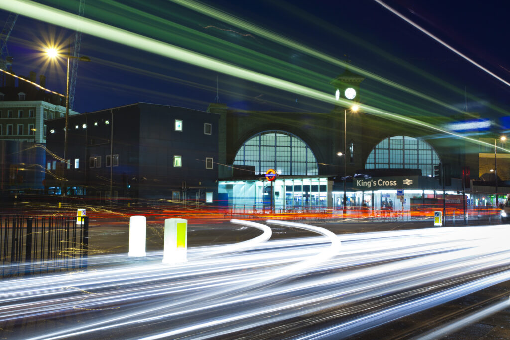 England, Greater London, London Borough of Camden. Rush hour traffic outside the London King's Cross railway station and underground.