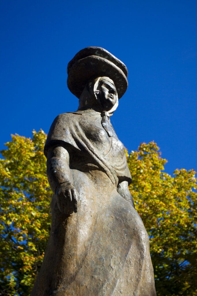 Spain, Catalonia, Pyrenees, Gósol. Statue of farm worker in the Gosol village square.