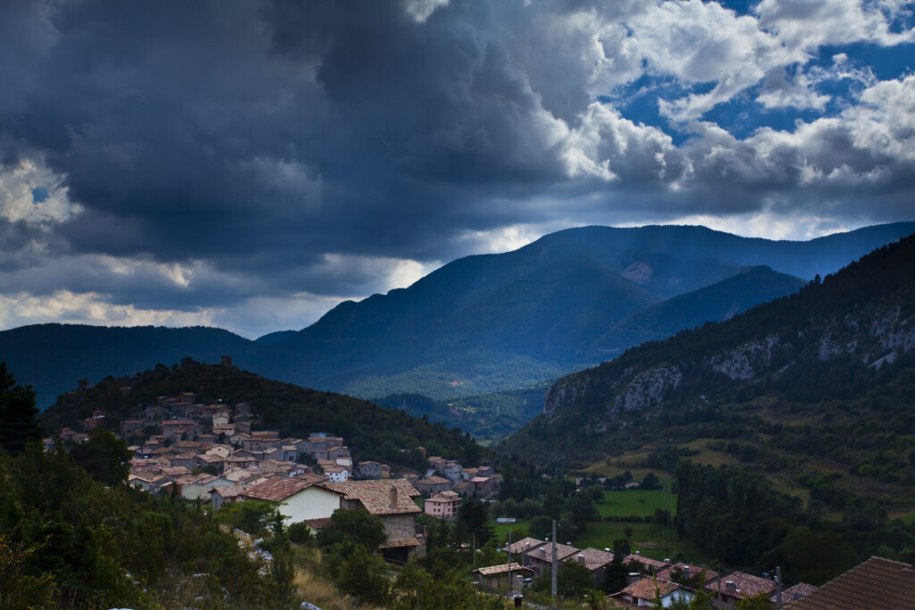 Spain, Catalonia, Pyrenees, Gósol. A storm brews above the village of Gosol in the Catalonian Pyrenees mountains.