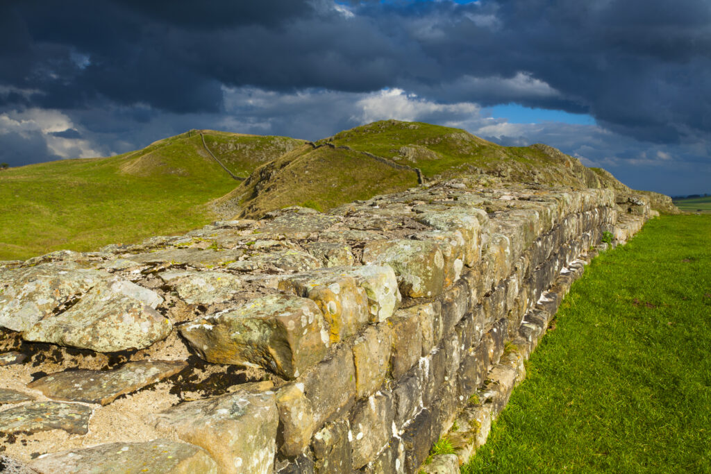 England, Northumberland, Northumberland National Park. A well preserved stretch of Hadrian's Wall passing along Caw Gap.