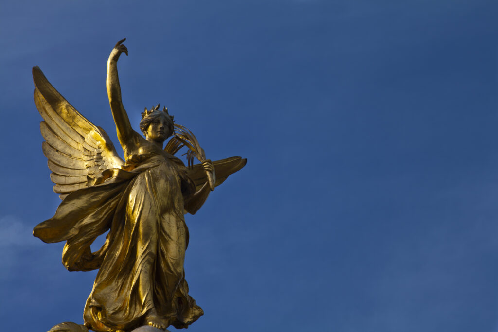 England, Greater London, City of Westminster. Statue of Victory on top of the Victoria Memorial in Queen's Garden near Buckingham Palace.