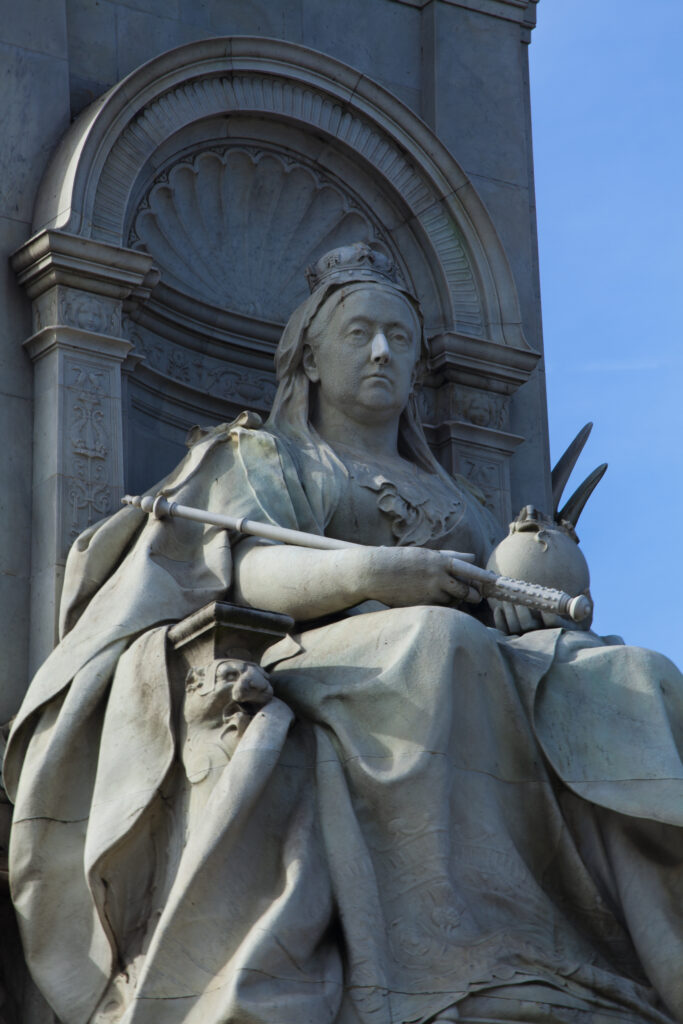 England, Greater London, City of Westminster. Statue of Queen Victoria on the Victoria Memorial in Queen's Garden near Buckingham Palace.
