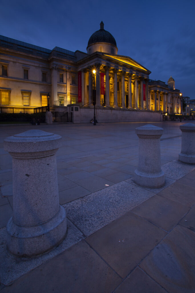 England, Greater London, City of Westminster. The National Gallery located in Trafalgar Square, a popular tourist destination in London, photographed at dusk.