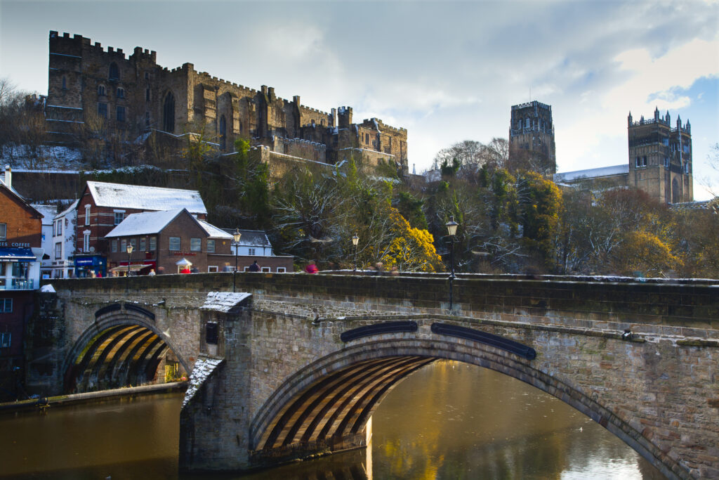 England, County Durham, Durham City. Bridge over the River Wear in the city of Durham, with Durham Castle and the Cathedral in the distance.