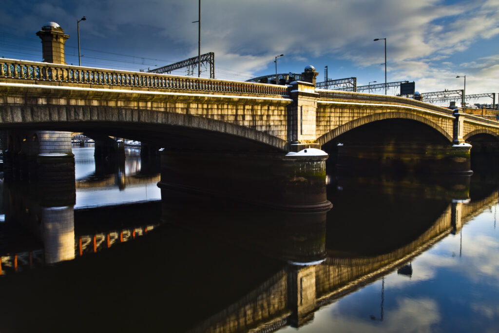 Scotland, Glasgow, Glasgow City. Glasgow bridge and railway bridge spanning the River Clyde in Glasgow.
