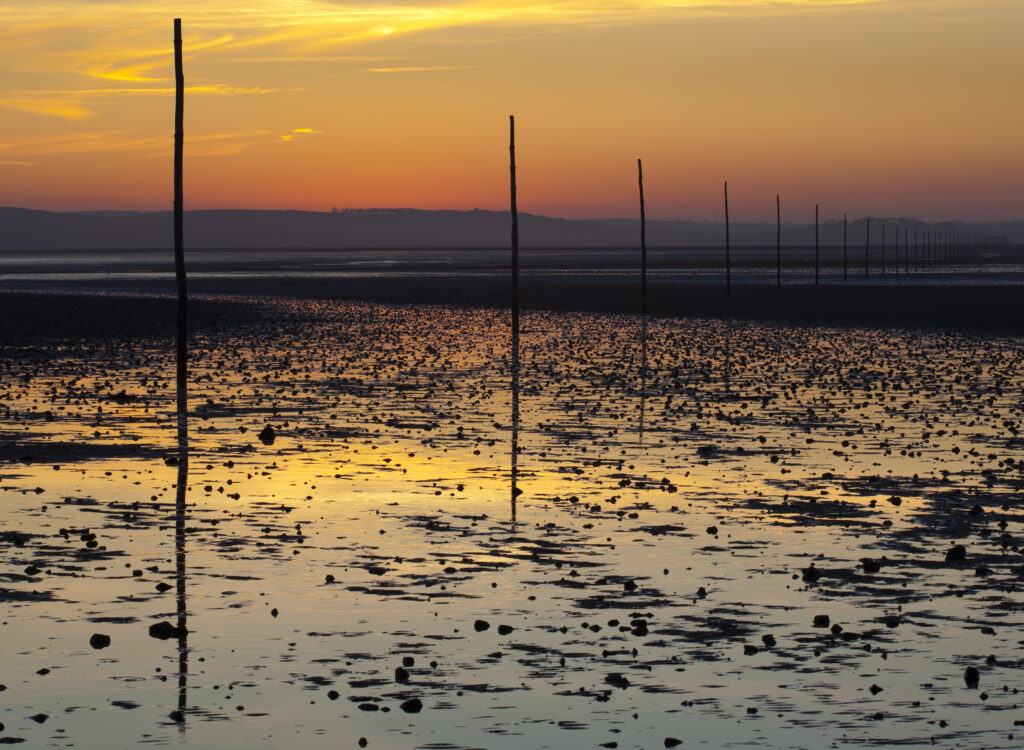 England, Northumberland, Northumberland Heritage Coast. The Pilgrim's Causeway linking the Holy Island of Lindisfarne off the Northumberland Coast with the mainland.