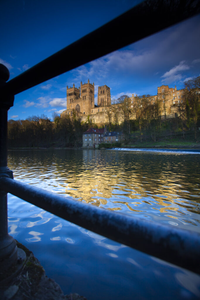 England, County Durham, Durham City. Durham Cathedral, situated above the river banks of the River Wear.
