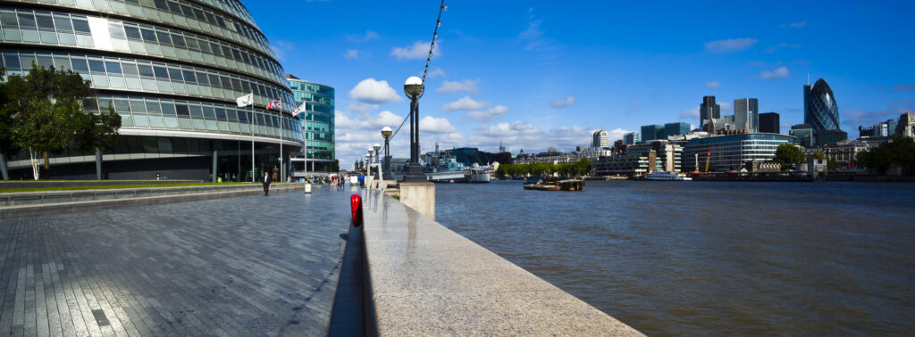 England, London, Southwark. Looking towards the City Hall and the London Financial District from the banks of the River Thames.