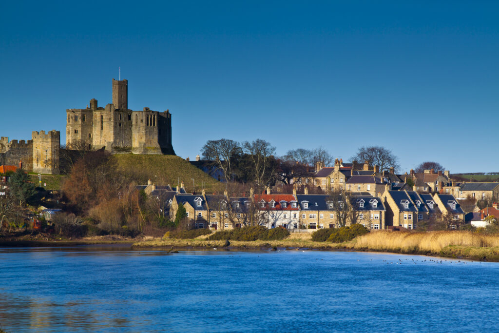 England, Northumberland, Warkworth. Warkworth Castle, a 12th-century stone motte and bailey fortress located near the Northumberland Heritage Coast.