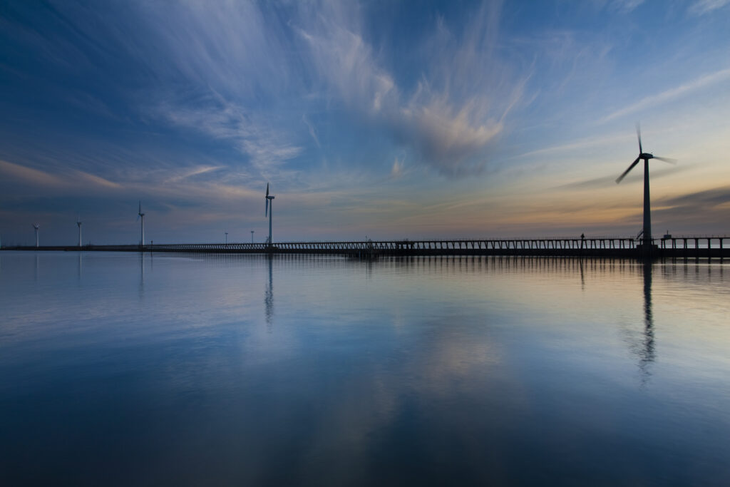 England, Northumberland, Blyth offshore wind farm. Dawn, looking towards the Blyth offshore wind farm - wind turbines located on the North Sea.
